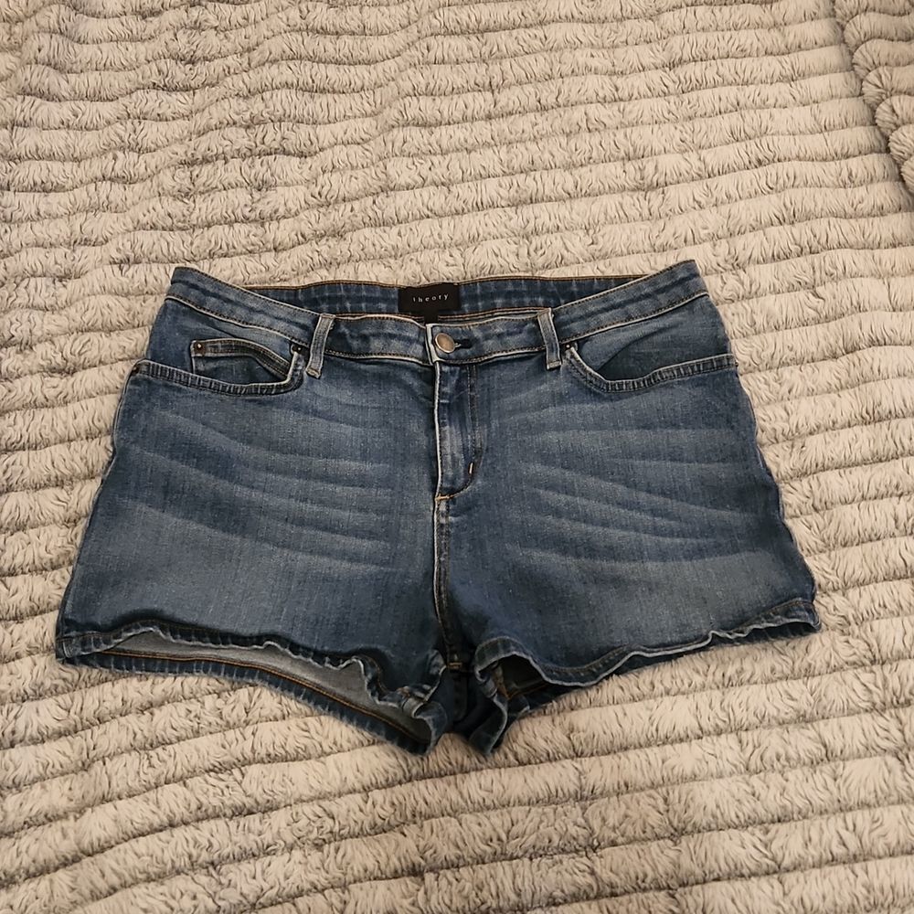 Medium wash high waist Theory jean shorts size 32.